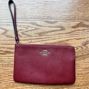 Coach burgundy wristlet